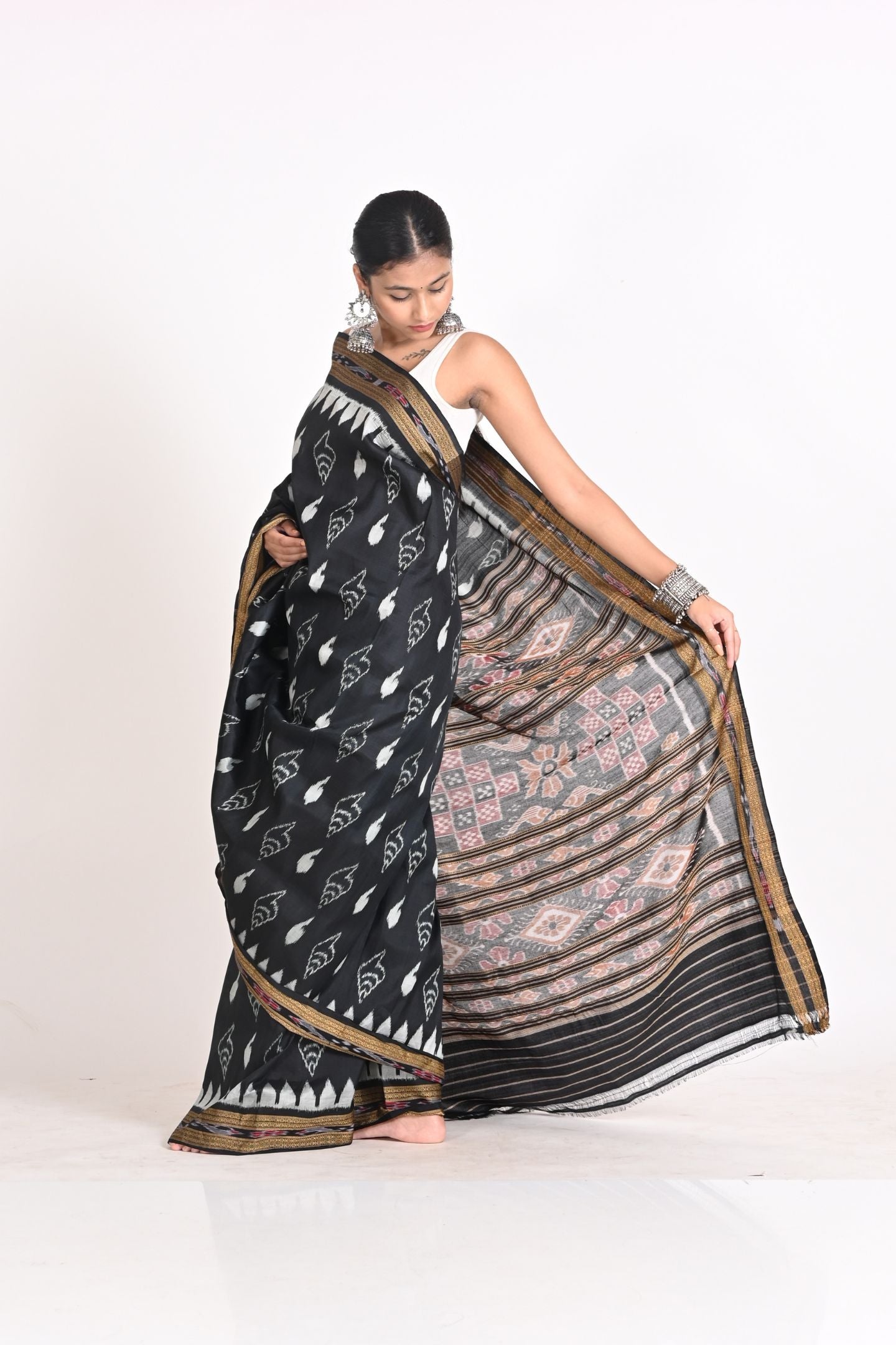 Handloom Black Ikat Silk Saree with Sankha Design